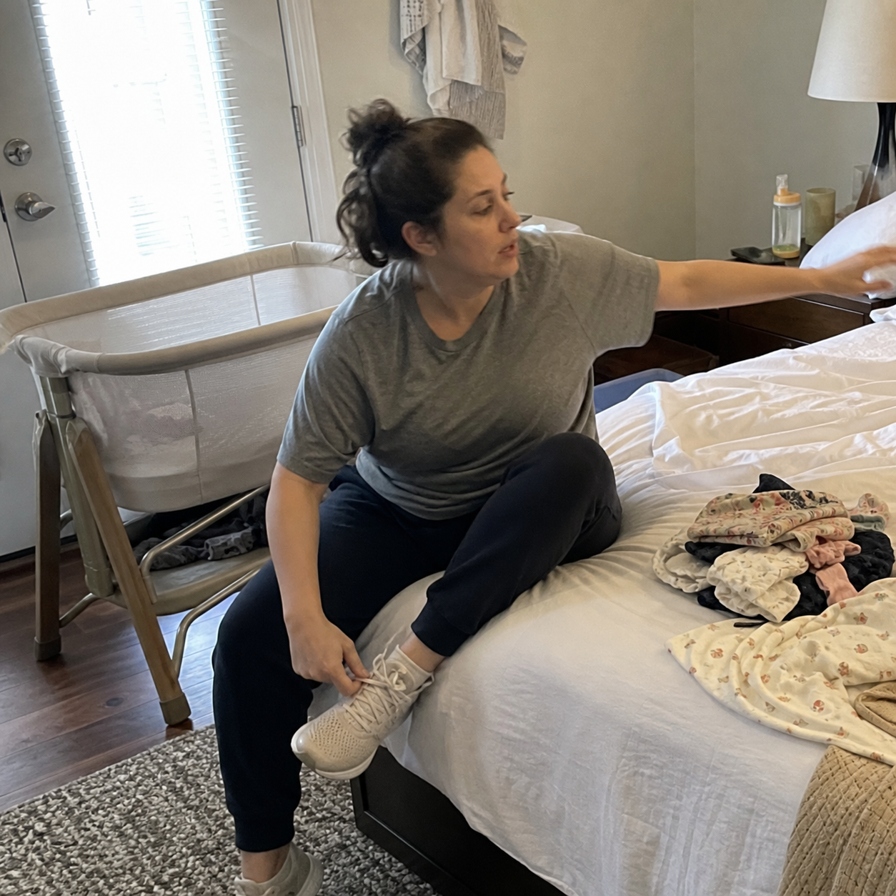 Postpartum mother getting ready during a busy morning at home